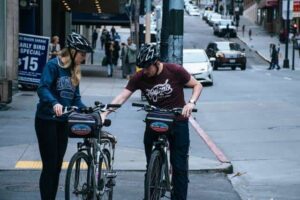 is riding a bike on the sidewalk illegal