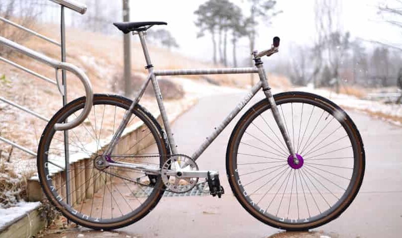 Why don't fixed gear bikes have brakes?