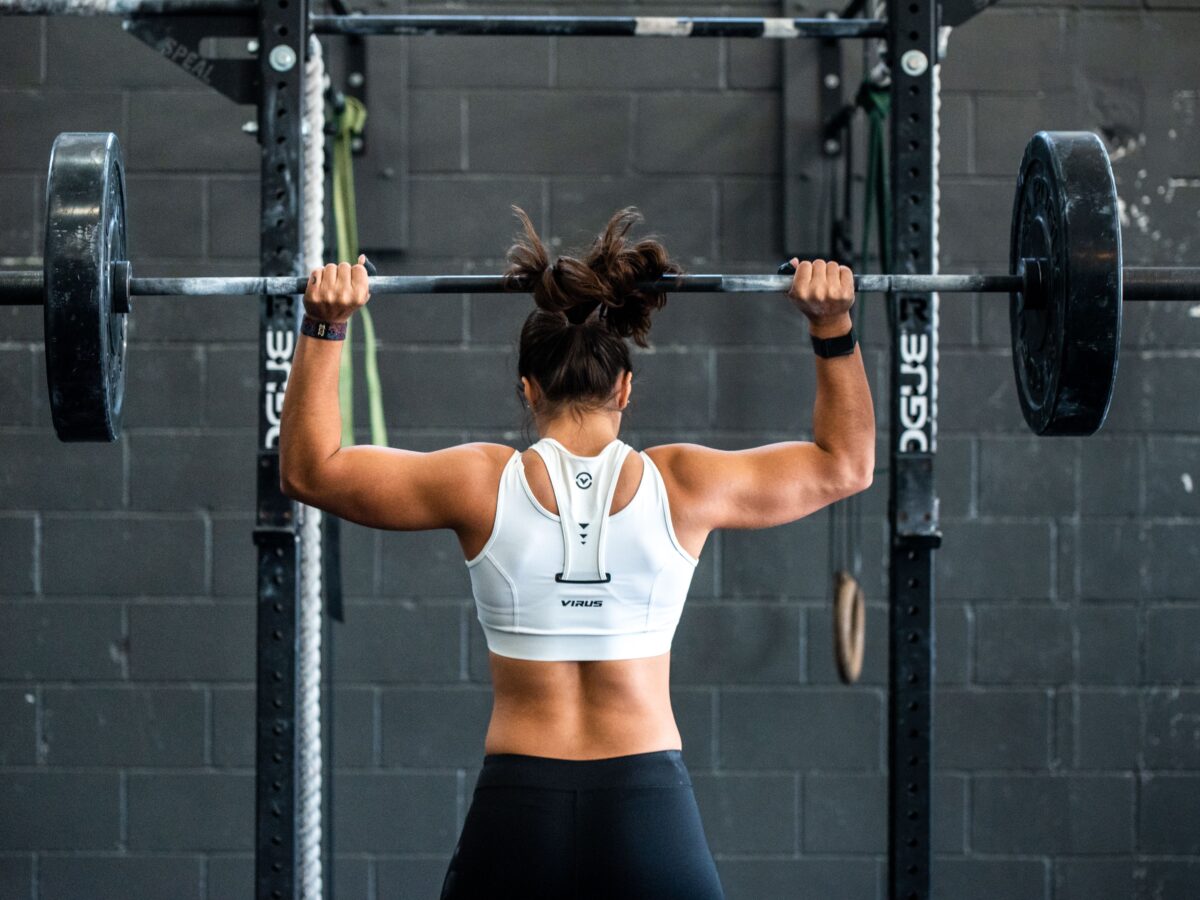 Going fit in mind, body, & connections with woman lifting weights