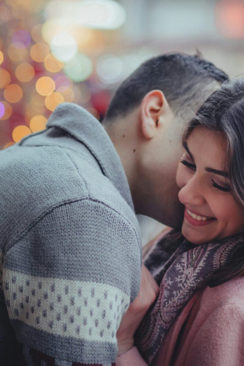 10 Unique Date Night Ideas to Rekindle the Spark in Your Relationship with man kissing woman on cheek date night couple