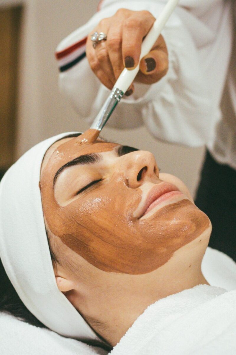 Embracing self-care in 40s: nurturing your best self with skincare person painting a face mask beauty