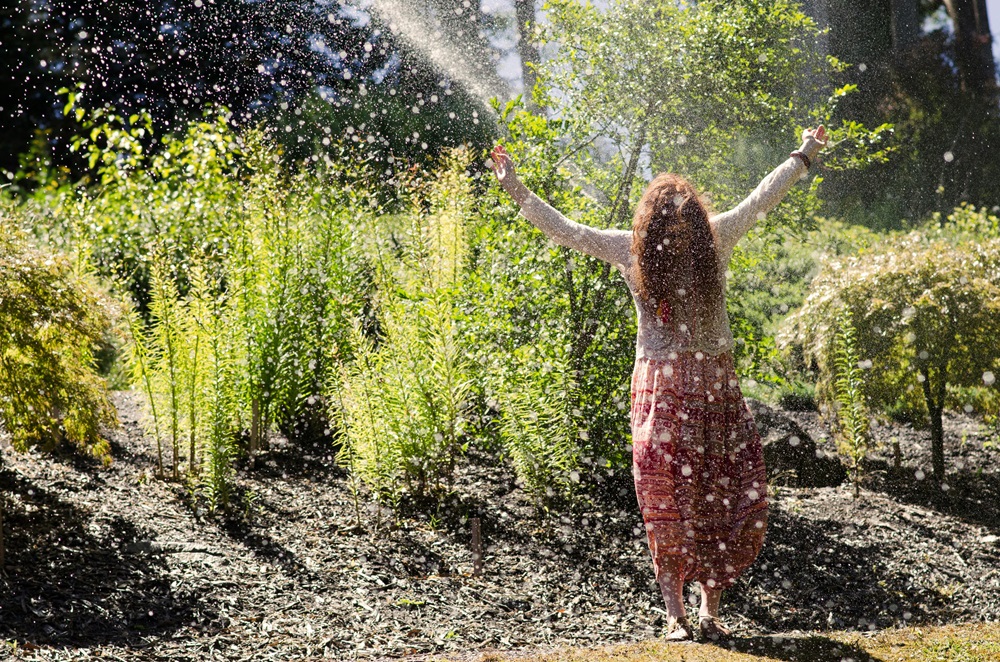 Living your healthiest life - woman taking in nature outside for healthy living