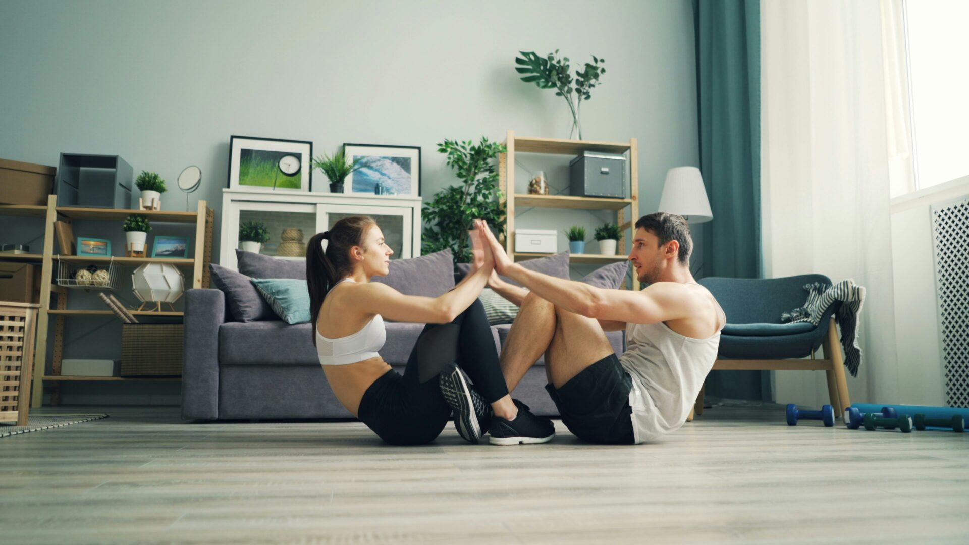 Married couple doing partner yoga as part of their couples exercise plan for stronger relationship
